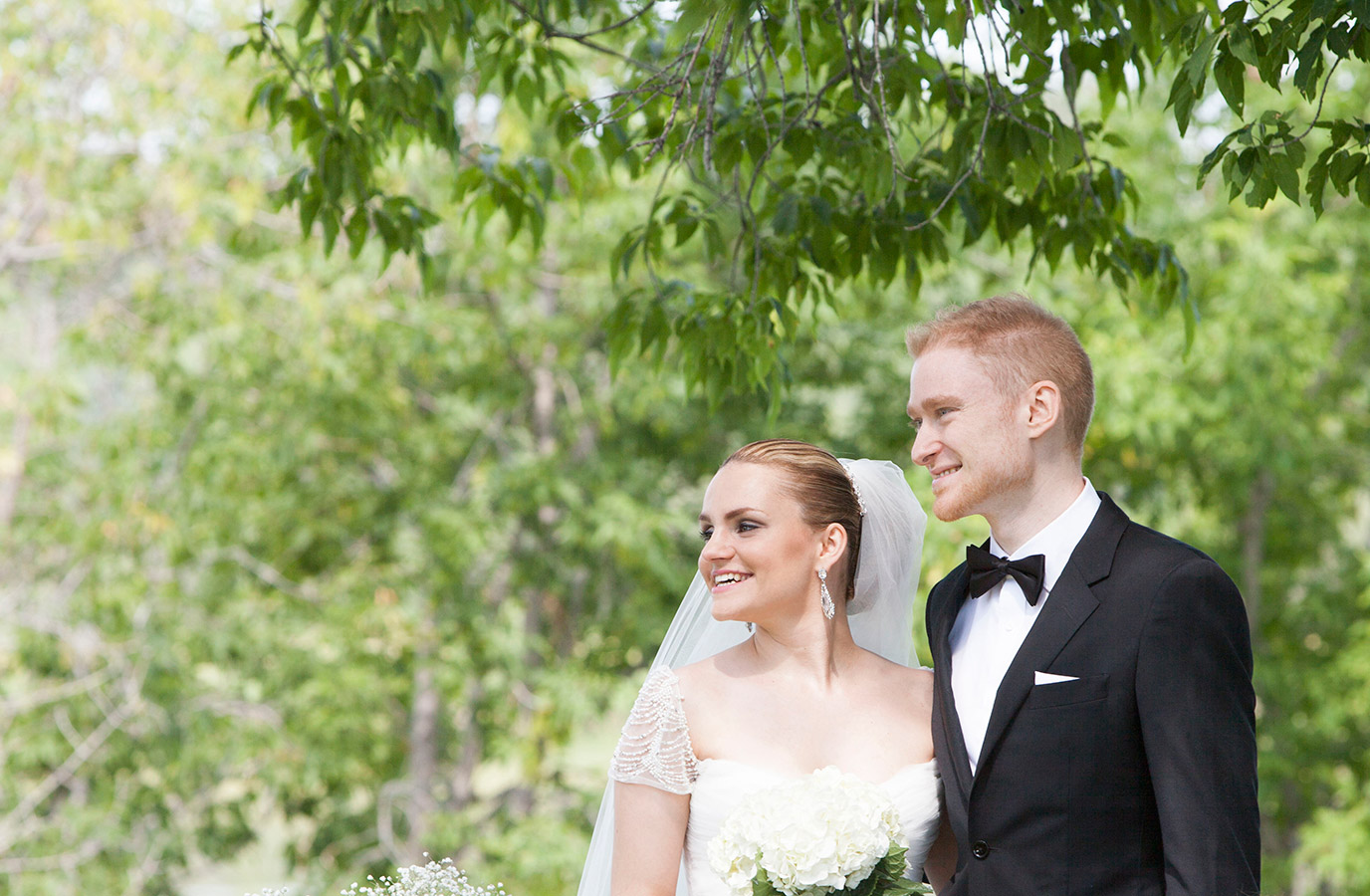 Prince Albert wedding photographer UBU Photos captures a couple smiling into the distance during portraits on their wedding day.